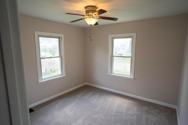 1326 E 19th Ave, Columbus, OH 43211 - carpeted spare room featuring healthy amount of natural light and a ceiling fan