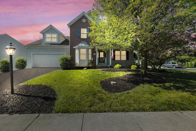 4003 Laurel Valley Dr, Powell, OH 43065 - view of front of home featuring a yard, driveway, and an attached garage