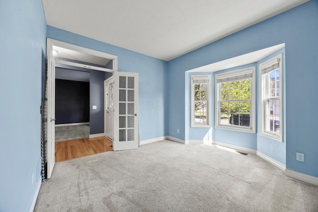 4003 Laurel Valley Dr, Powell, OH 43065 - carpeted spare room with baseboards and french doors