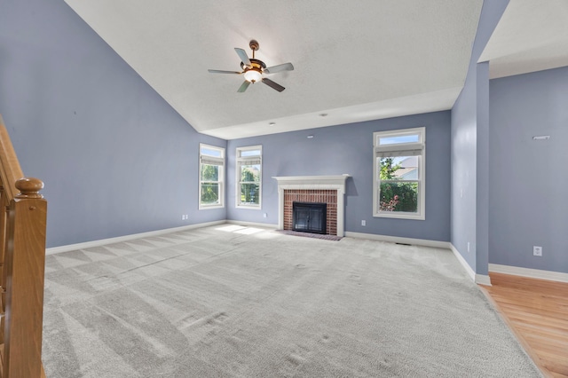 4003 Laurel Valley Dr, Powell, OH 43065 - unfurnished living room featuring ceiling fan, a fireplace, carpet flooring, and vaulted ceiling