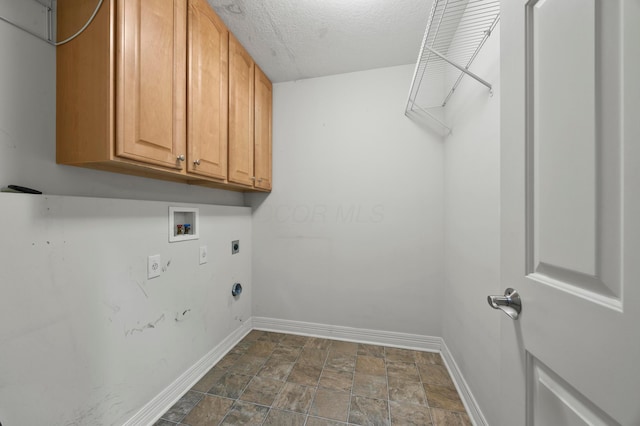 4003 Laurel Valley Dr, Powell, OH 43065 - laundry room with electric dryer hookup, cabinet space, hookup for a washing machine, stone finish floors, and a textured ceiling