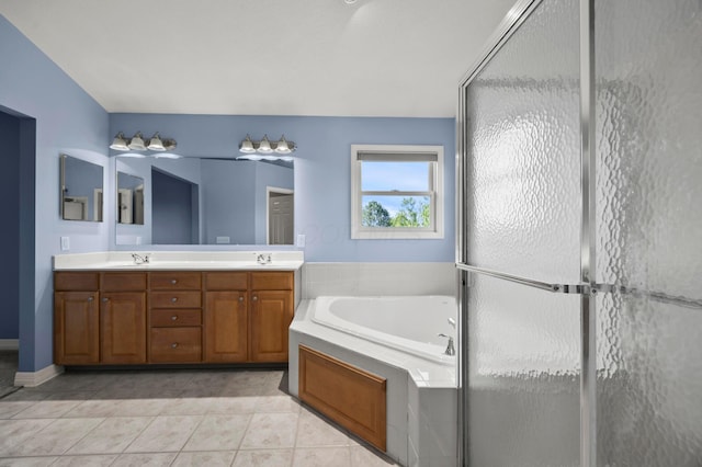 4003 Laurel Valley Dr, Powell, OH 43065 - bathroom featuring double vanity, a garden tub, tile patterned floors, and a stall shower