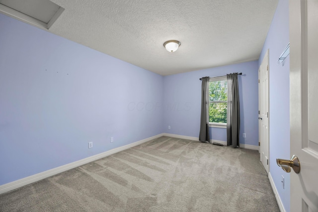 4003 Laurel Valley Dr, Powell, OH 43065 - carpeted empty room featuring a textured ceiling and attic access
