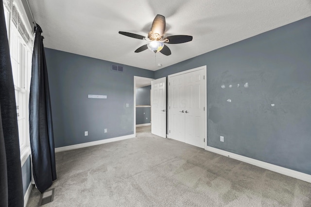 4003 Laurel Valley Dr, Powell, OH 43065 - unfurnished bedroom with carpet flooring, ceiling fan, and a closet