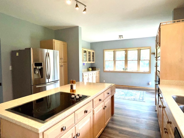 793 Waldo Fulton Rd, Waldo, OH 43356 - kitchen featuring stainless steel fridge with ice dispenser, black electric cooktop, dark wood-type flooring, a center island, and light stone counters