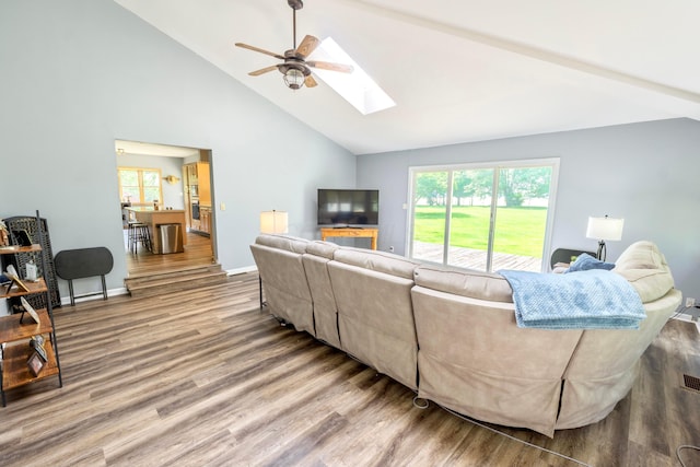 793 Waldo Fulton Rd, Waldo, OH 43356 - living area featuring ceiling fan, wood finished floors, a skylight, and high vaulted ceiling