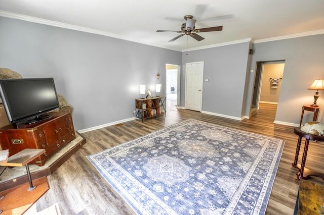 793 Waldo Fulton Rd, Waldo, OH 43356 - living room featuring wood finished floors, a ceiling fan, and ornamental molding