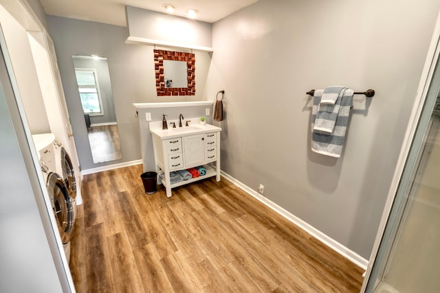 793 Waldo Fulton Rd, Waldo, OH 43356 - bathroom featuring washer and dryer, wood finished floors, and vanity
