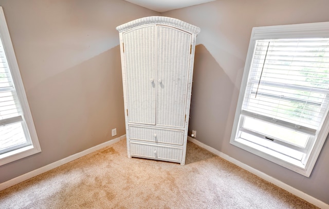 793 Waldo Fulton Rd, Waldo, OH 43356 - unfurnished bedroom featuring multiple windows and carpet flooring