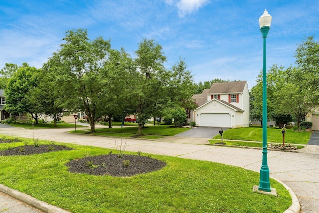 7954 Windrift Pl, Reynoldsburg, OH 43068 - view of grassy yard with a garage and driveway