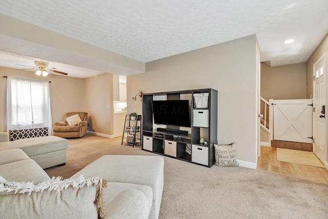 1439 Tall Meadows Dr, Columbus, OH 43223 - carpeted living area featuring stairs, ceiling fan, a textured ceiling, and recessed lighting
