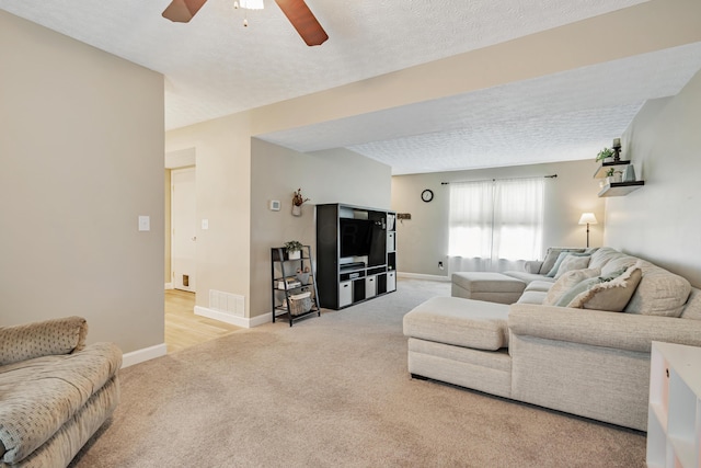 1439 Tall Meadows Dr, Columbus, OH 43223 - living room with light carpet, ceiling fan, and a textured ceiling
