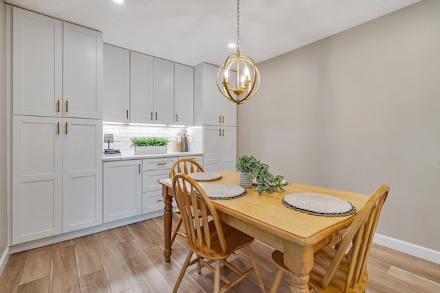 1439 Tall Meadows Dr, Columbus, OH 43223 - dining area with light wood-style floors, a chandelier, and recessed lighting