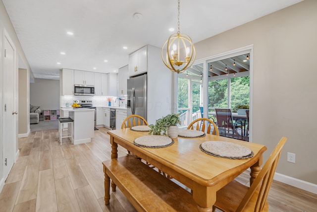 1439 Tall Meadows Dr, Columbus, OH 43223 - dining area featuring light wood finished floors, recessed lighting, and a chandelier
