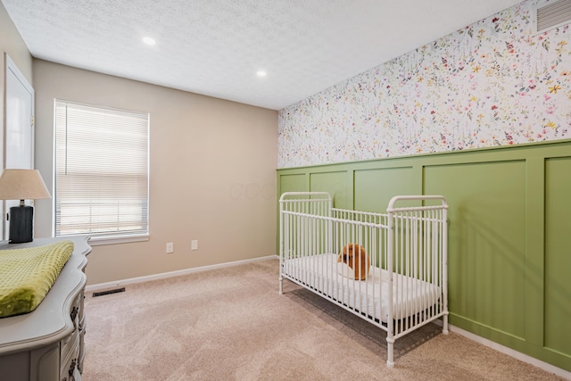 1439 Tall Meadows Dr, Columbus, OH 43223 - carpeted bedroom with wallpapered walls, recessed lighting, wainscoting, and a textured ceiling