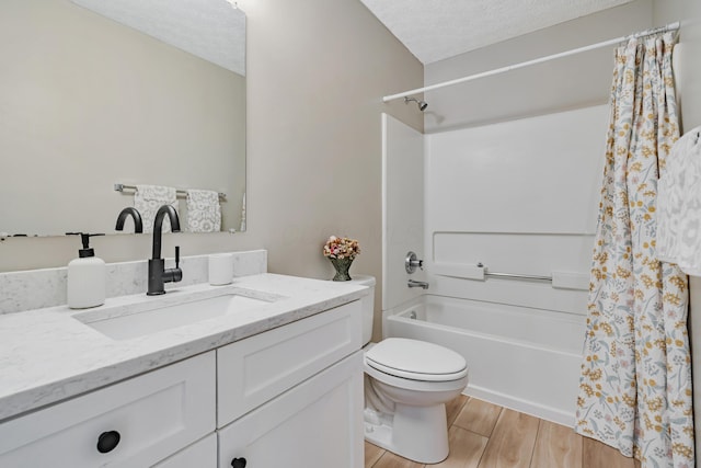 1439 Tall Meadows Dr, Columbus, OH 43223 - bathroom with shower / bath combo, vanity, wood finished floors, and a textured ceiling