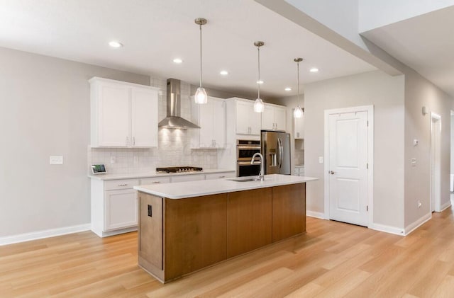 600 Courtright Dr E, Pickerington, OH 43147 - kitchen with wall chimney exhaust hood, appliances with stainless steel finishes, light wood-style floors, backsplash, and recessed lighting
