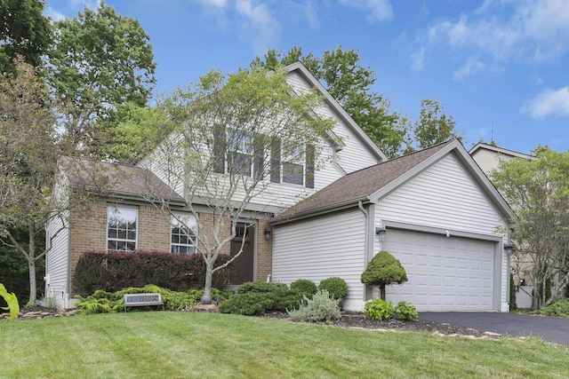 437 Barrington Rdg, Pataskala, OH 43062 - traditional-style house with asphalt driveway, an attached garage, a front lawn, brick siding, and roof with shingles