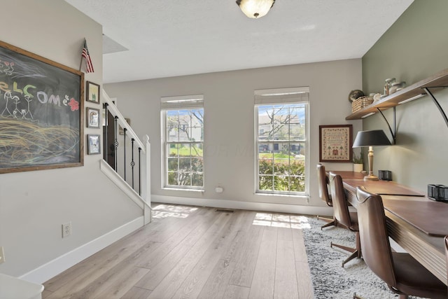 437 Barrington Rdg, Pataskala, OH 43062 - home office featuring hardwood / wood-style flooring and a textured ceiling
