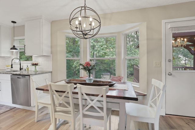 437 Barrington Rdg, Pataskala, OH 43062 - dining space featuring a chandelier, healthy amount of natural light, and light wood-style flooring