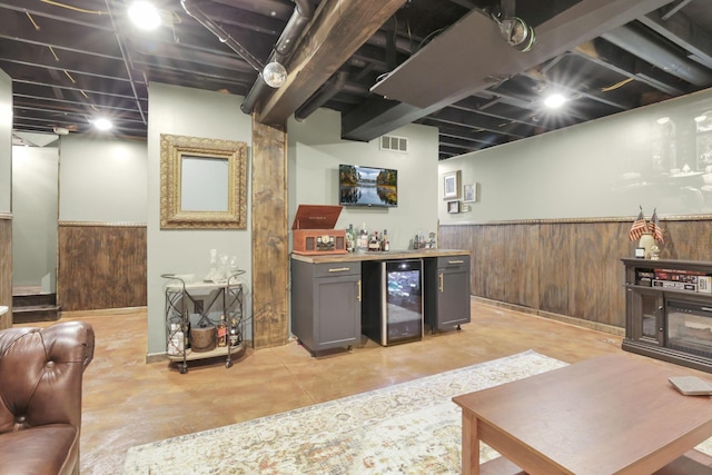 437 Barrington Rdg, Pataskala, OH 43062 - indoor dry bar featuring beverage cooler, concrete floors, a wainscoted wall, and wooden walls