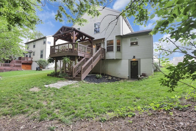 437 Barrington Rdg, Pataskala, OH 43062 - back of house featuring a wooden deck, a lawn, and stairway