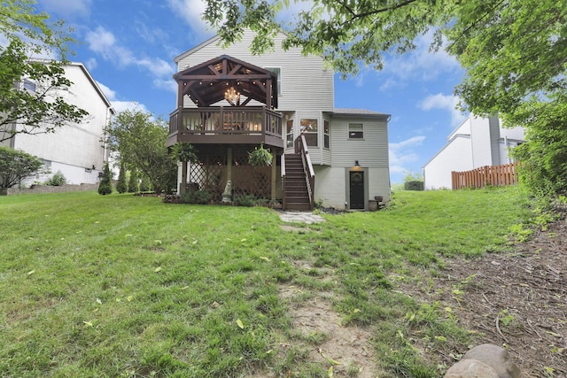 437 Barrington Rdg, Pataskala, OH 43062 - rear view of property featuring a wooden deck, a lawn, and stairs
