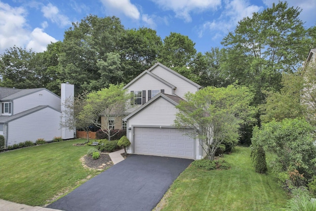 437 Barrington Rdg, Pataskala, OH 43062 - view of front facade featuring driveway, a garage, and a front lawn