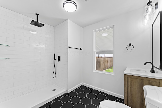 137 E Morrill Ave, Columbus, OH 43207 - bathroom with tiled shower, tile patterned floors, and vanity