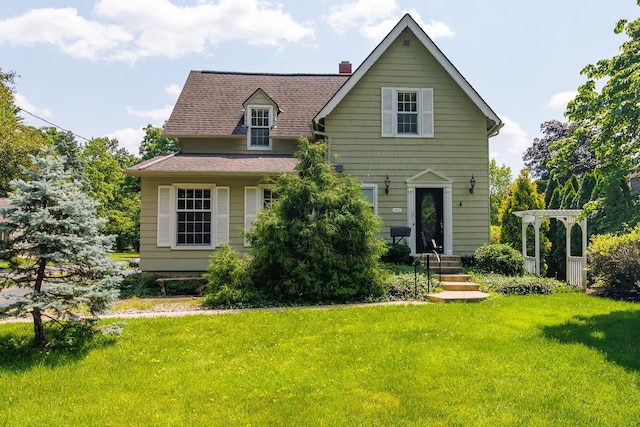 670 Greenwich St, Worthington, OH 43085 - view of front of home featuring a front lawn, a chimney, and a shingled roof