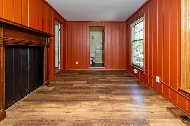 670 Greenwich St, Worthington, OH 43085 - unfurnished living room with wood finished floors and wood walls