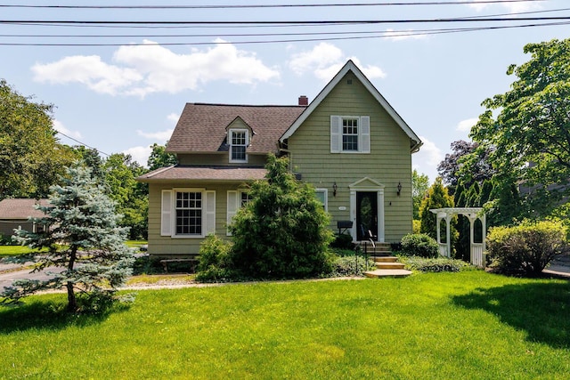670 Greenwich St, Worthington, OH 43085 - view of front facade featuring a chimney, a front lawn, and roof with shingles
