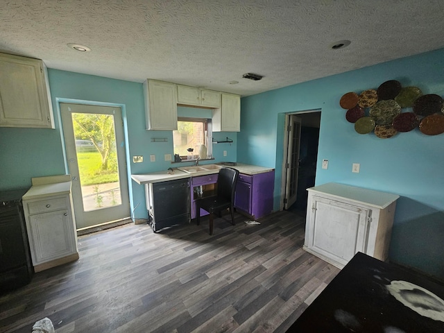 710 Glendower Ave, Columbus, OH 43207 - kitchen with dishwasher, dark wood-type flooring, healthy amount of natural light, an office area, and a textured ceiling
