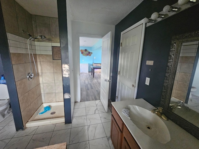 710 Glendower Ave, Columbus, OH 43207 - full bathroom with tiled shower, vanity, and marble finish floors