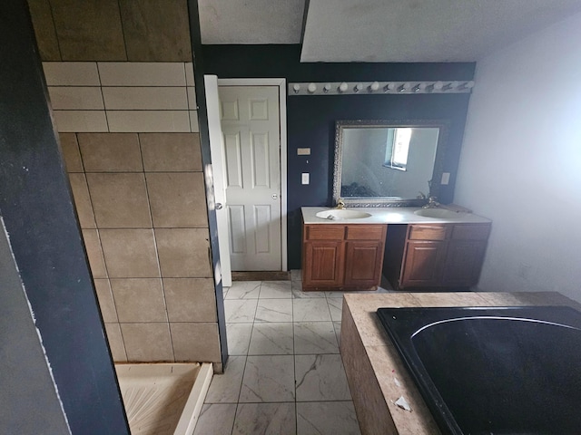 710 Glendower Ave, Columbus, OH 43207 - full bath featuring marble finish flooring, tiled bath, and double vanity