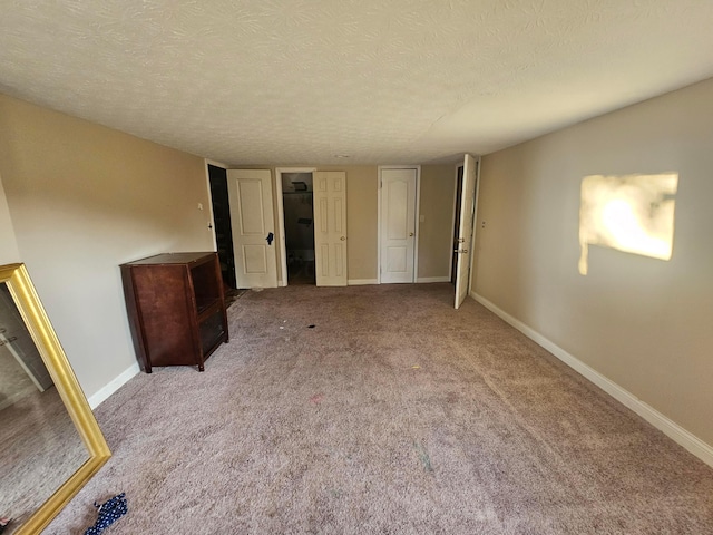710 Glendower Ave, Columbus, OH 43207 - unfurnished bedroom with carpet and a textured ceiling