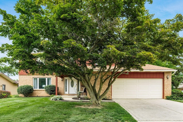 2740 Mitzi Dr, Columbus, OH 43209 - obstructed view of property featuring driveway, an attached garage, a front yard, and brick siding