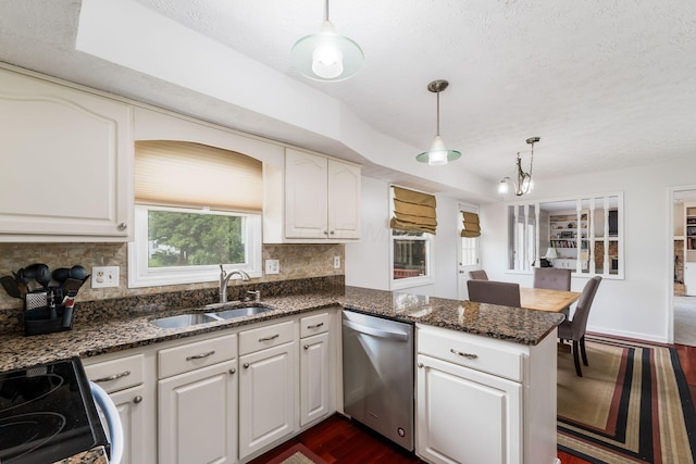 2740 Mitzi Dr, Columbus, OH 43209 - kitchen featuring stainless steel dishwasher, electric range, a peninsula, decorative backsplash, and dark wood-style flooring