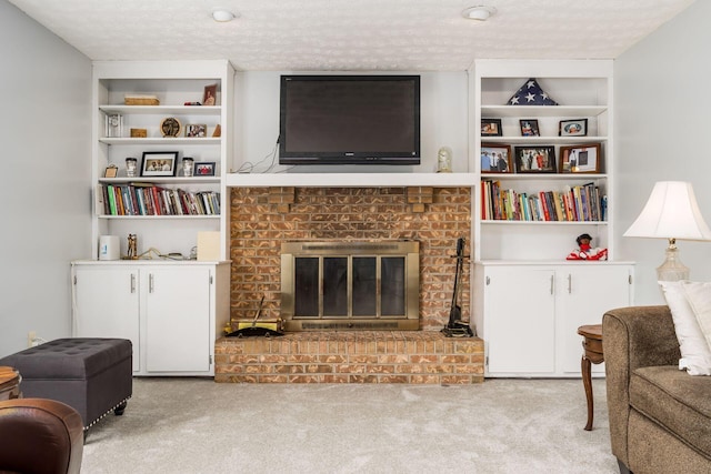 2740 Mitzi Dr, Columbus, OH 43209 - carpeted living area with a brick fireplace, a textured ceiling, and built in shelves
