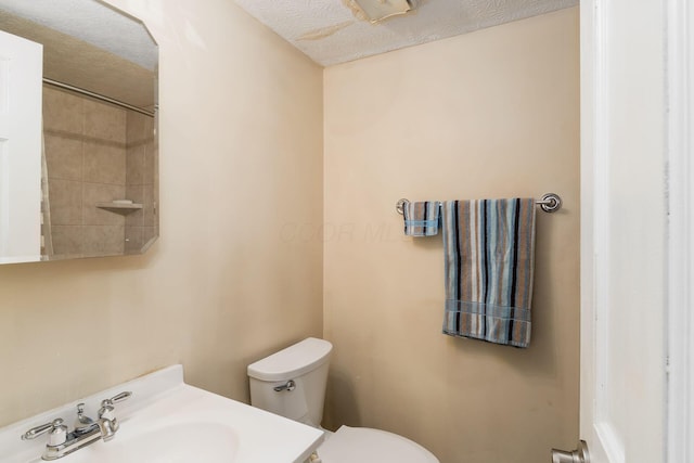 2740 Mitzi Dr, Columbus, OH 43209 - bathroom with vanity, a shower, and a textured ceiling