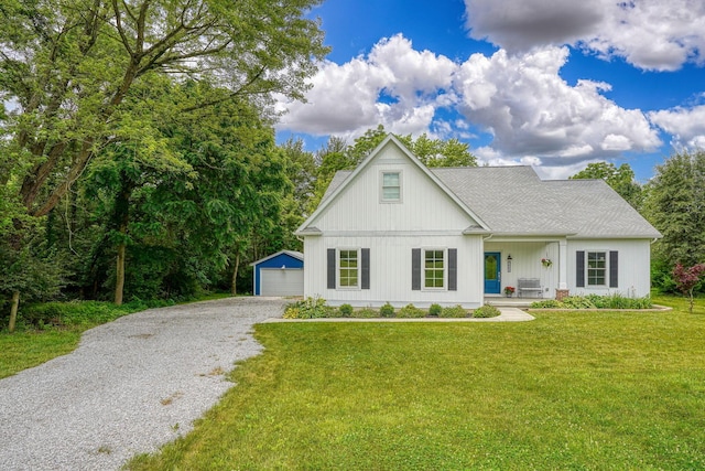 3663 Cedar Hill Rd NW, Canal Winchester, OH 43110 - modern farmhouse style home featuring an outdoor structure, covered porch, a front yard, driveway, and a detached garage