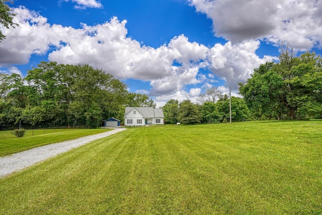 3663 Cedar Hill Rd NW, Canal Winchester, OH 43110 - view of green lawn featuring driveway and a wooded view