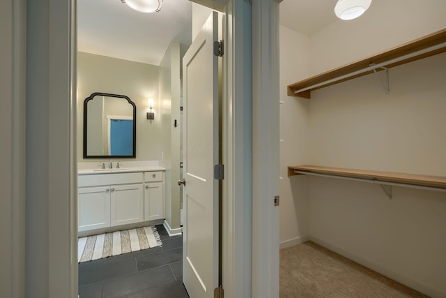 3663 Cedar Hill Rd NW, Canal Winchester, OH 43110 - spacious closet featuring a sink and dark tile patterned floors