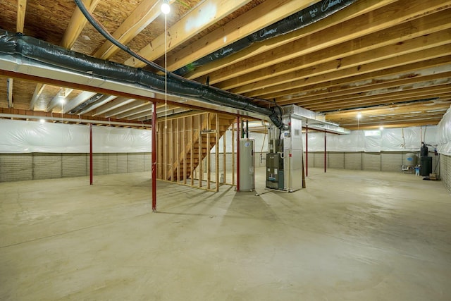 3663 Cedar Hill Rd NW, Canal Winchester, OH 43110 - unfinished basement with water heater, heating unit, and stairs