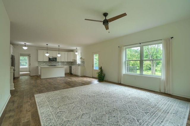 3663 Cedar Hill Rd NW, Canal Winchester, OH 43110 - unfurnished living room featuring dark wood-style floors and ceiling fan