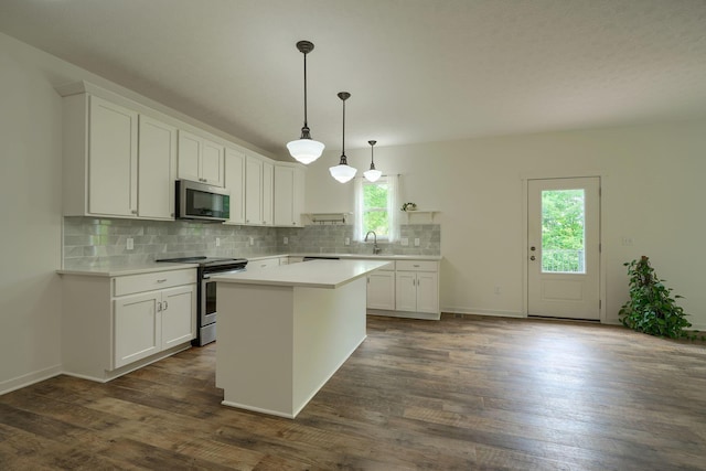 3663 Cedar Hill Rd NW, Canal Winchester, OH 43110 - kitchen featuring appliances with stainless steel finishes, light countertops, tasteful backsplash, and white cabinetry