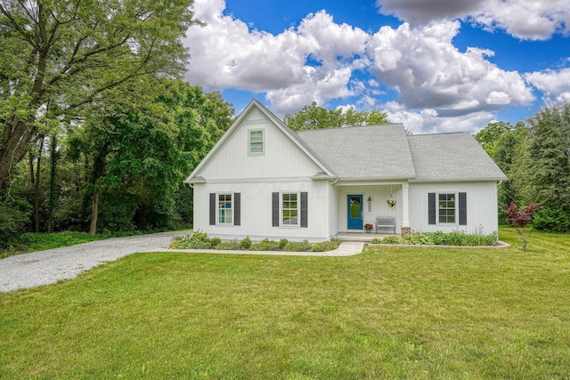 3663 Cedar Hill Rd NW, Canal Winchester, OH 43110 - modern farmhouse with covered porch, a front yard, and gravel driveway