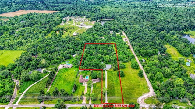 3663 Cedar Hill Rd NW, Canal Winchester, OH 43110 - aerial view of property and surrounding area with property boundaries highlighted and a heavily wooded area