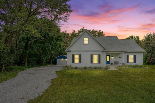 3663 Cedar Hill Rd NW, Canal Winchester, OH 43110 - modern farmhouse featuring an outbuilding, gravel driveway, covered porch, and a lawn