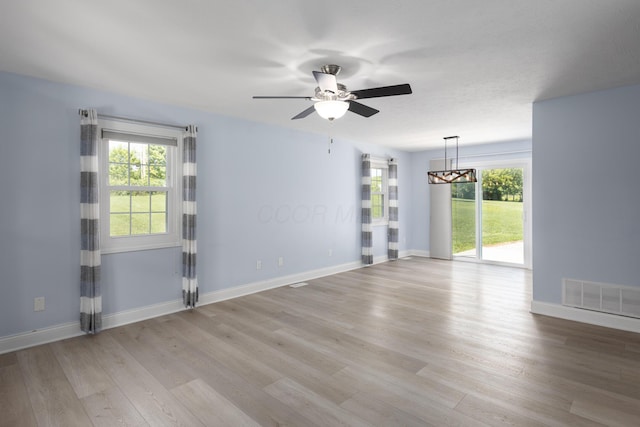 6704 Blacks Rd SW, Pataskala, OH 43062 - unfurnished room featuring healthy amount of natural light, light wood finished floors, and ceiling fan